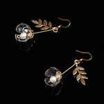 just a flower earrings clear gold